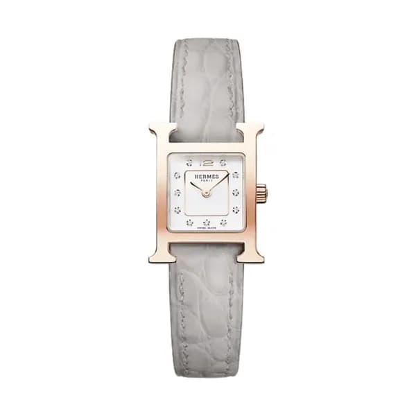 Hermès Montre HERMÈS Heure H Mini Modèle plaqué or rose quartz cadran laqué blanc bracelet cuir gris 21 mm