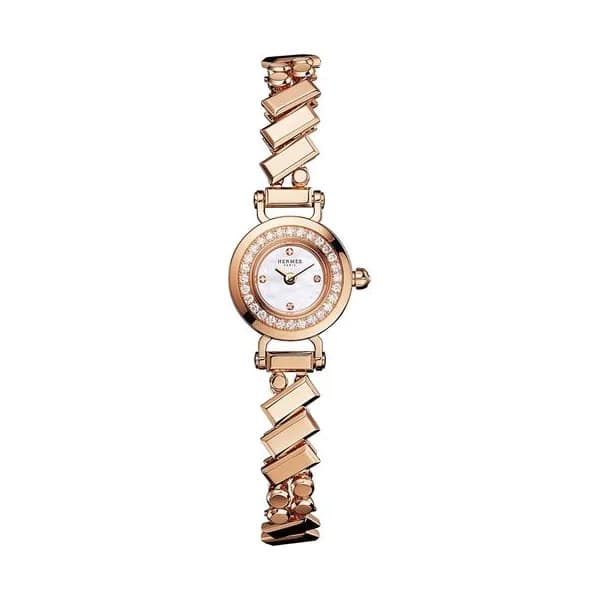 Hermès Montre HERMÈS Faubourg Polka Mini Modèle Or Rose quartz cadran nacre blanche bracelet or rose 15 mm